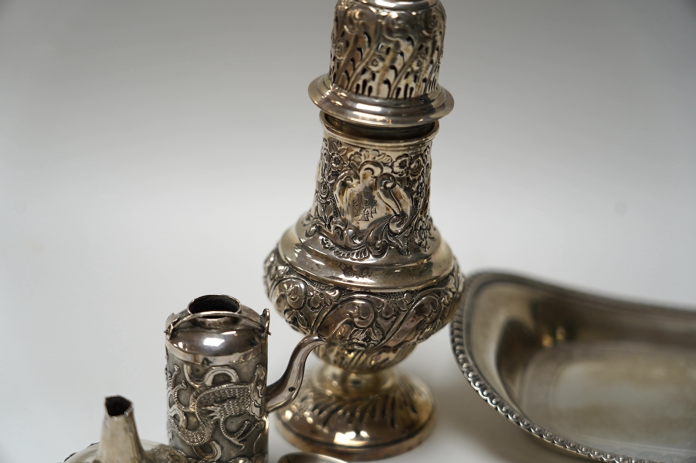 A George III silver snuffers stand, London, 1810, 22.8cm, together with sundry silver flatware, a silver sugar caster, a miniature Chinese white metal tea kettle by Wang Hing, lacking cover and one other item. Condition